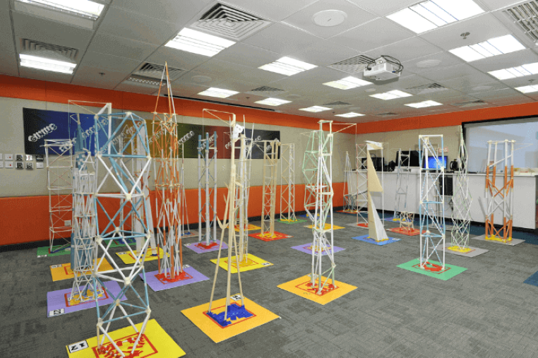 Several paper tower projects being displayed at an engineering summer camp Several paper tower projects being displayed at an engineering summer camp