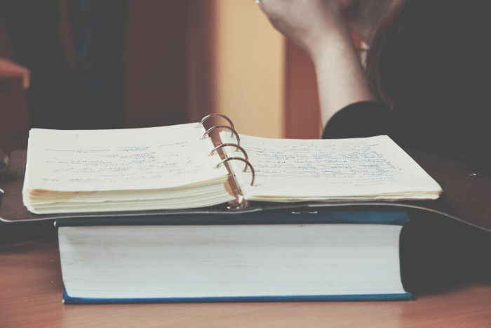 A student taking notes to become an academic writer A student taking notes to become an academic writer
