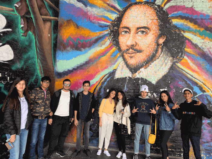 Students in front of a mural of Shakespeare in London, England Students in front of a mural of Shakespeare in London, England