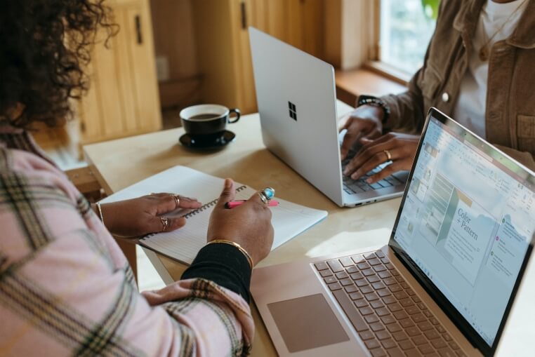 Two students working on a presentation for a virtual internship Two students working on a presentation for a virtual internship