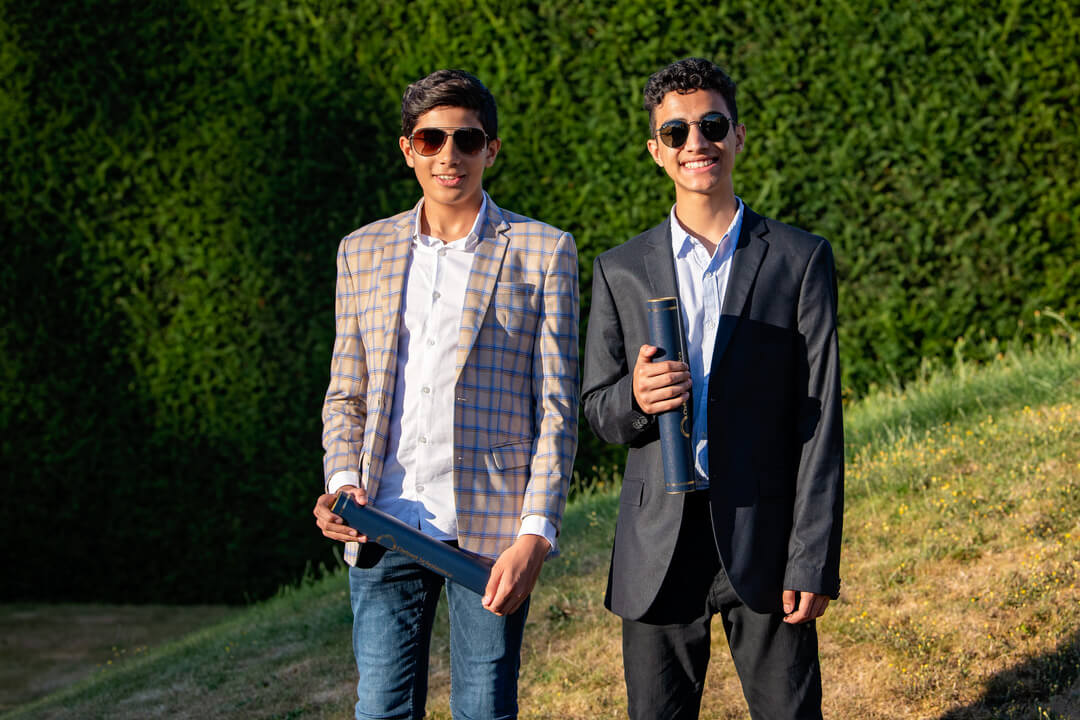 Two students celebrating their success.